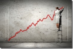 businesswoman drawing diagrams on wall